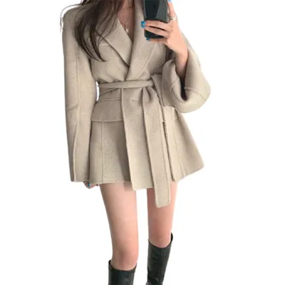 A buckle lace up waist slimming long sleeve woolen coat