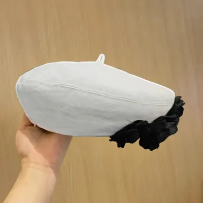 A Fashionable And Fluffy Painter's Hat That Makes Your Face Look Good