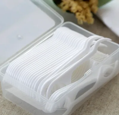 Disposable dental floss stick-white-polymer polyethylene fiber-50 sticks-1 box