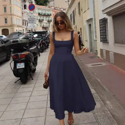 A Chic Tailored Dress With A Subtle Design That Accentuates The Waist